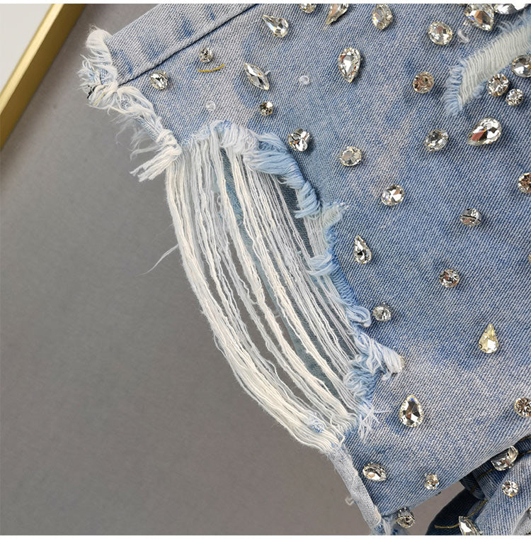 Modern women's wide-leg ripped shorts, a trendy distressed high-waist style for summer fashion and casual wear.