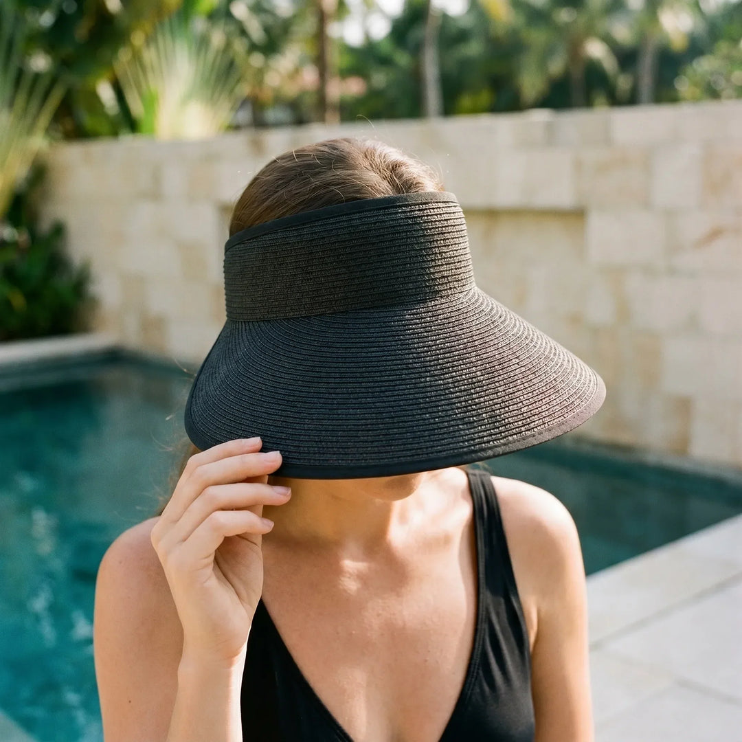 Women's roll-up sun visor hat for easy travel. Packable wide brim summer beach accessory.
