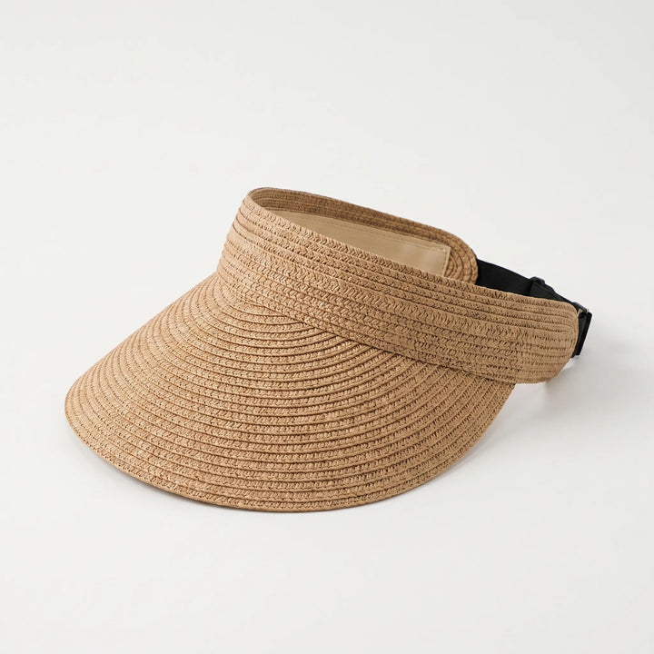 Chic women's wide brim sun hat, roll-up design for travel. A must-have summer accessory for beach or vacation.