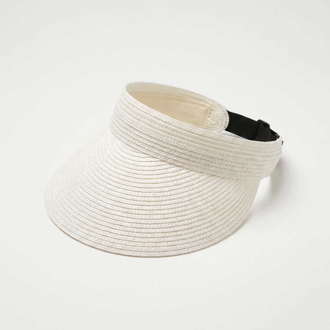 Packable women's sun visor for travel. Adjustable open-top hat with wide brim, perfect for summer beach days.