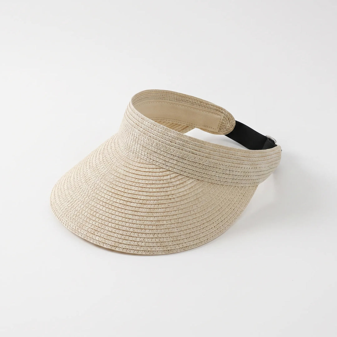Women's wide brim sun visor, roll-up and adjustable. Great for summer, beach, and travel. Offers sun protection.