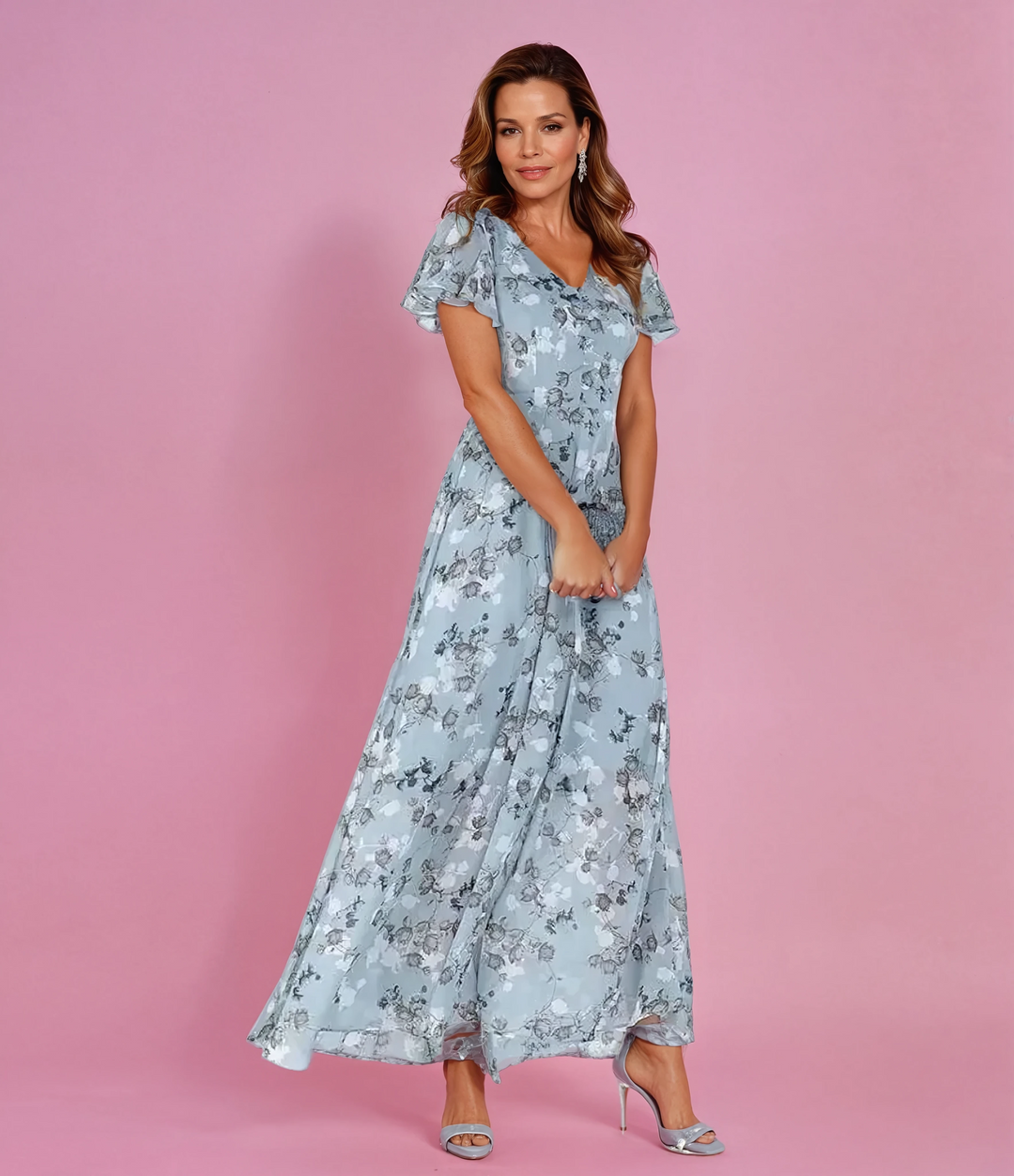 Women's romantic floral maxi dress with elegant flutter sleeves, perfect for summer parties or vacations.
