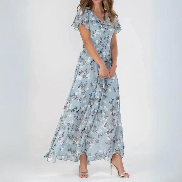 Flowy women's floral maxi dress with flutter sleeves. Casual chic for summer, spring events, or special occasions.