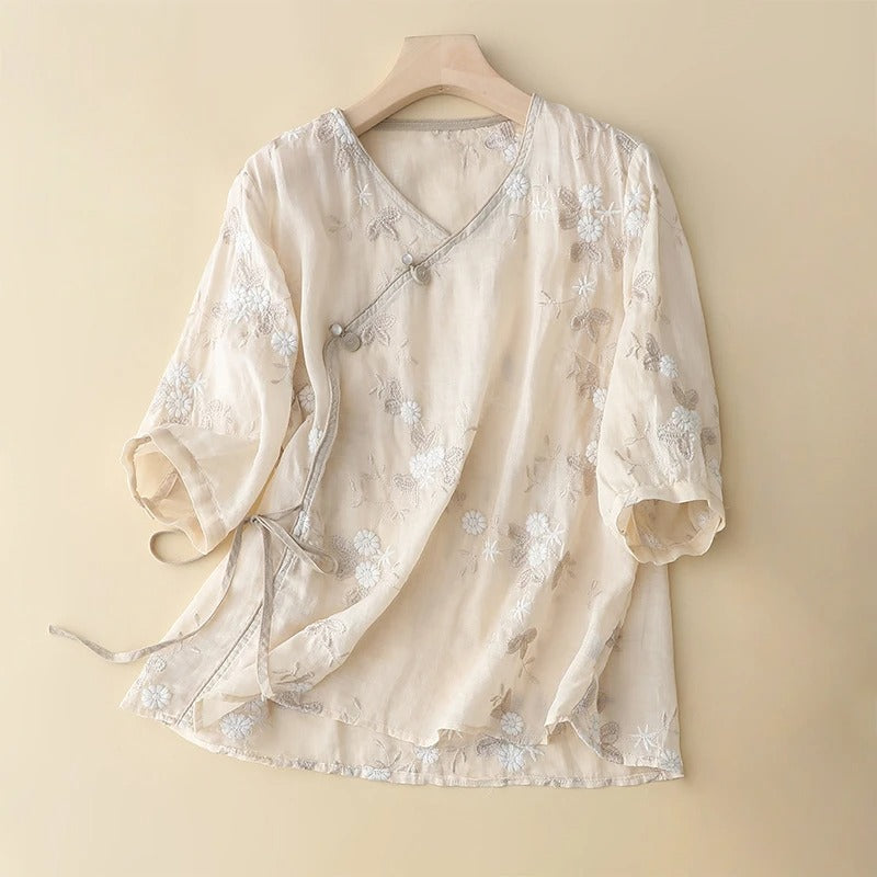 Women's romantic flowing blouse with delicate botanical embroidery, perfect for spring and summer elegant casual chic wear.