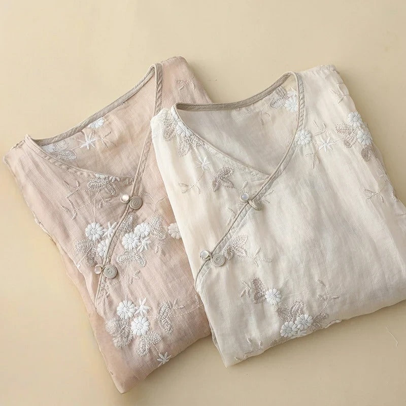 Flowing women's embroidered blouse with delicate botanical patterns, a versatile romantic top for elegant and casual chic outfits.