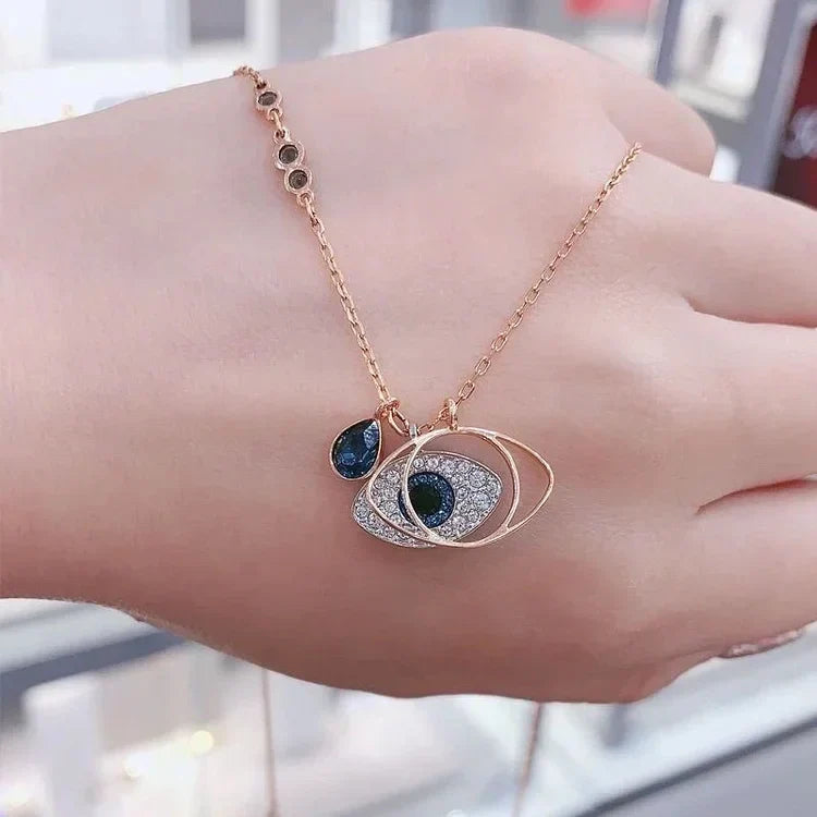 Delicate women's Evil Eye protection necklace & bracelet set, rose gold finish, stylish fashion accessory.