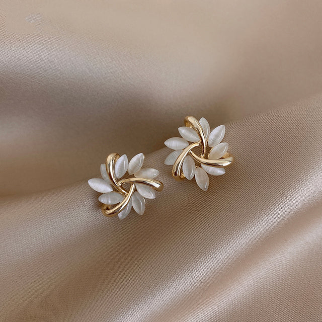 Women's round opal flower stud earrings in elegant gold setting, perfect delicate jewelry fashion accessory.