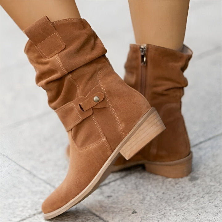Chic women's ruched ankle boots. Cushioned comfort, easy side zip. Essential versatile footwear for fall & winter fashion.