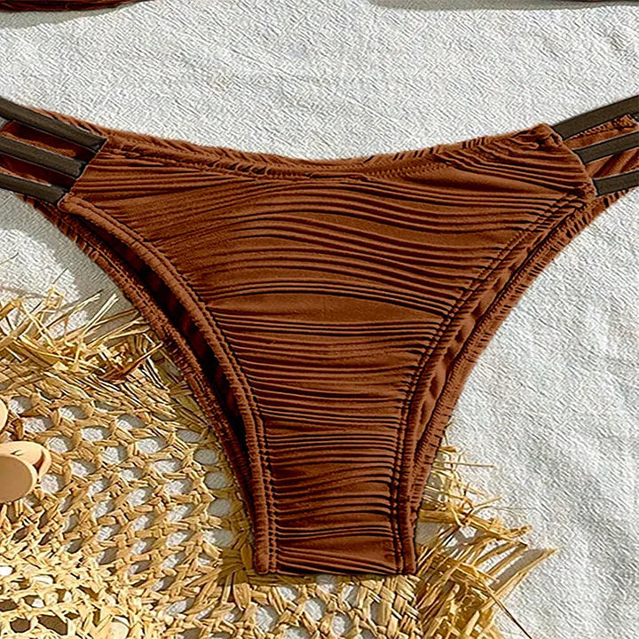 Summer beach day women's ruched bandeau bikini set, boho Tulum style swimwear. Ideal for vacation.