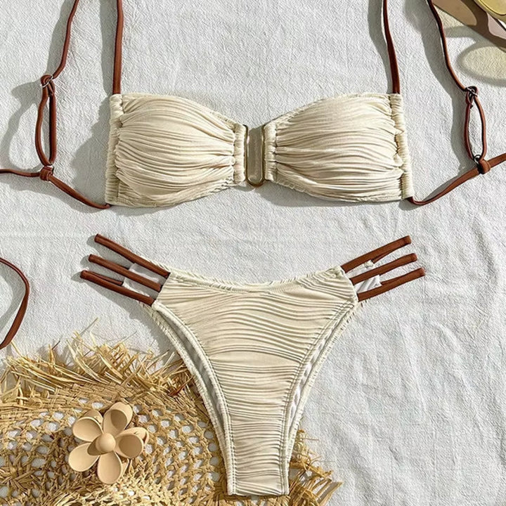 Elegant ruched bandeau bikini top and matching bottom. Women's two-piece Tulum style swimwear set.