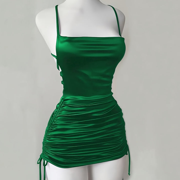 Glamorous women's ruched drawstring mini dress, perfect for a captivating homecoming or party look.