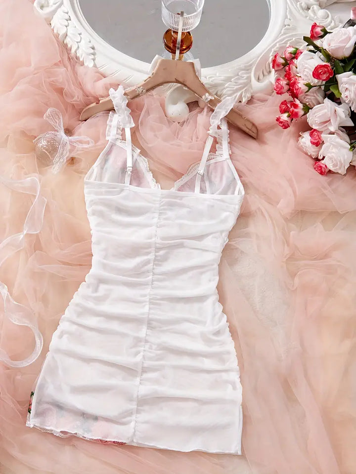 Elegant women's sleepwear: a ruched mesh nightgown with stunning floral embroidery. Perfect lingerie.