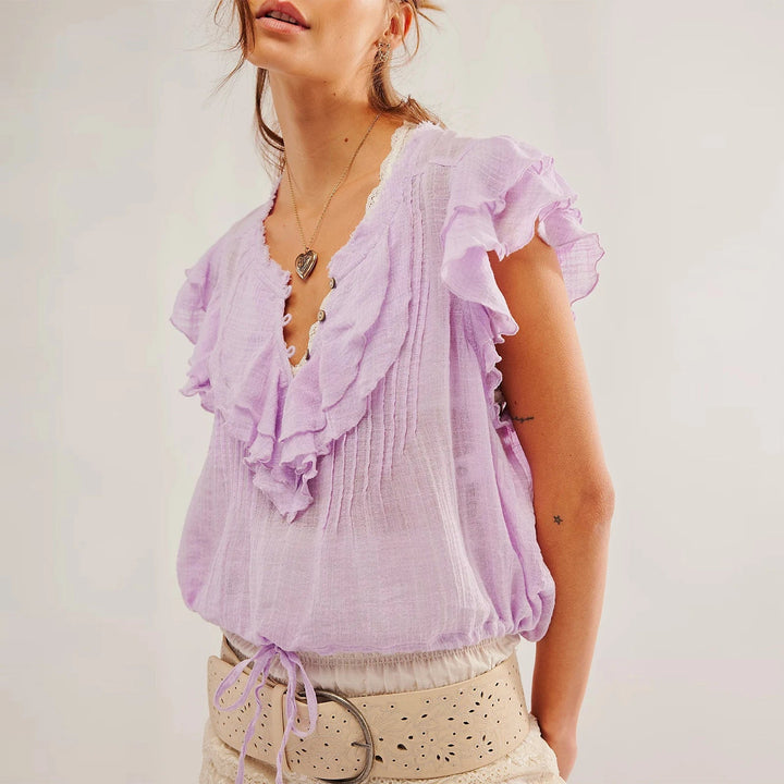 Beach-ready women's ruffle crop top, short sleeve and stylish for summer days.