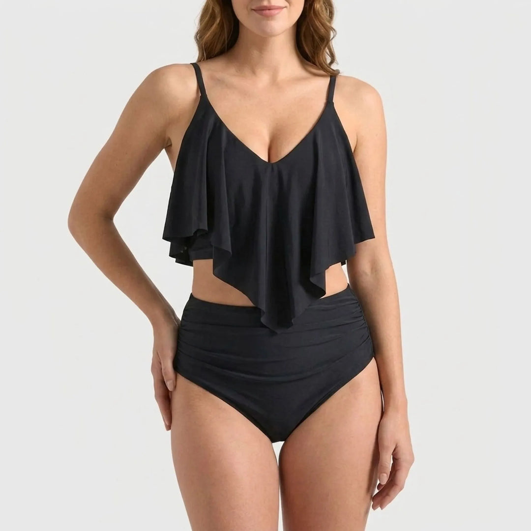 Flattering women's two-piece high-waisted bikini with stylish ruffle top, ideal for pool attire.