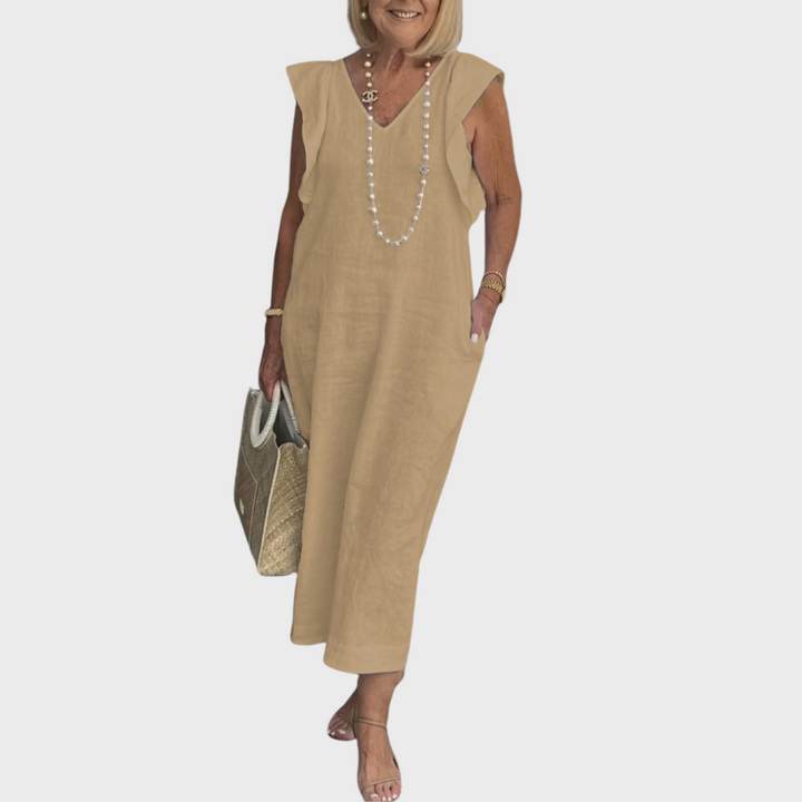 Relaxed fit sleeveless V-neck maxi dress for women, with ruffle shoulders & pockets, ideal for warm days.