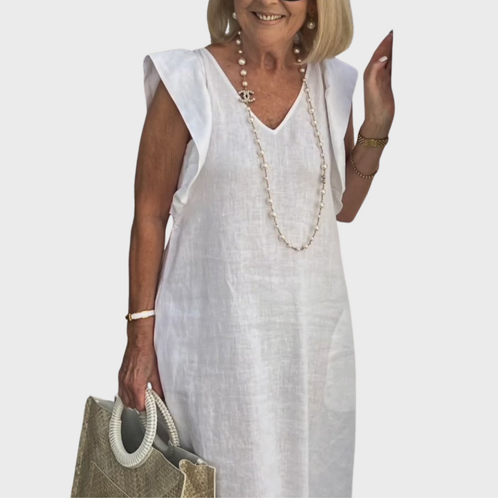 Casual women's maxi dress with ruffle shoulders & V-neck, sleeveless. Ideal for warm weather & beach.