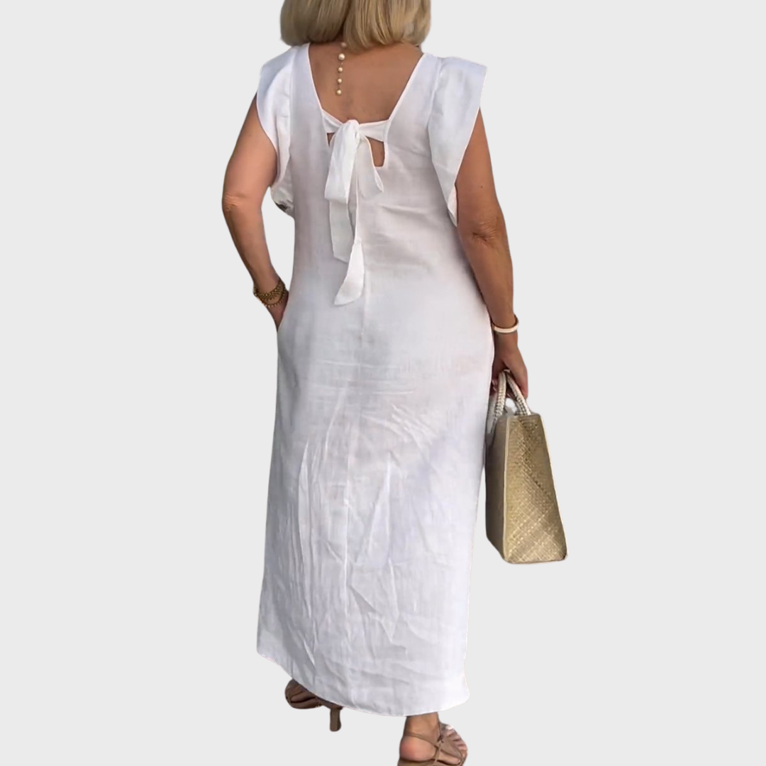 Relaxed fit women's sleeveless maxi dress, V-neck, ruffle shoulders, handy pockets for casual wear.