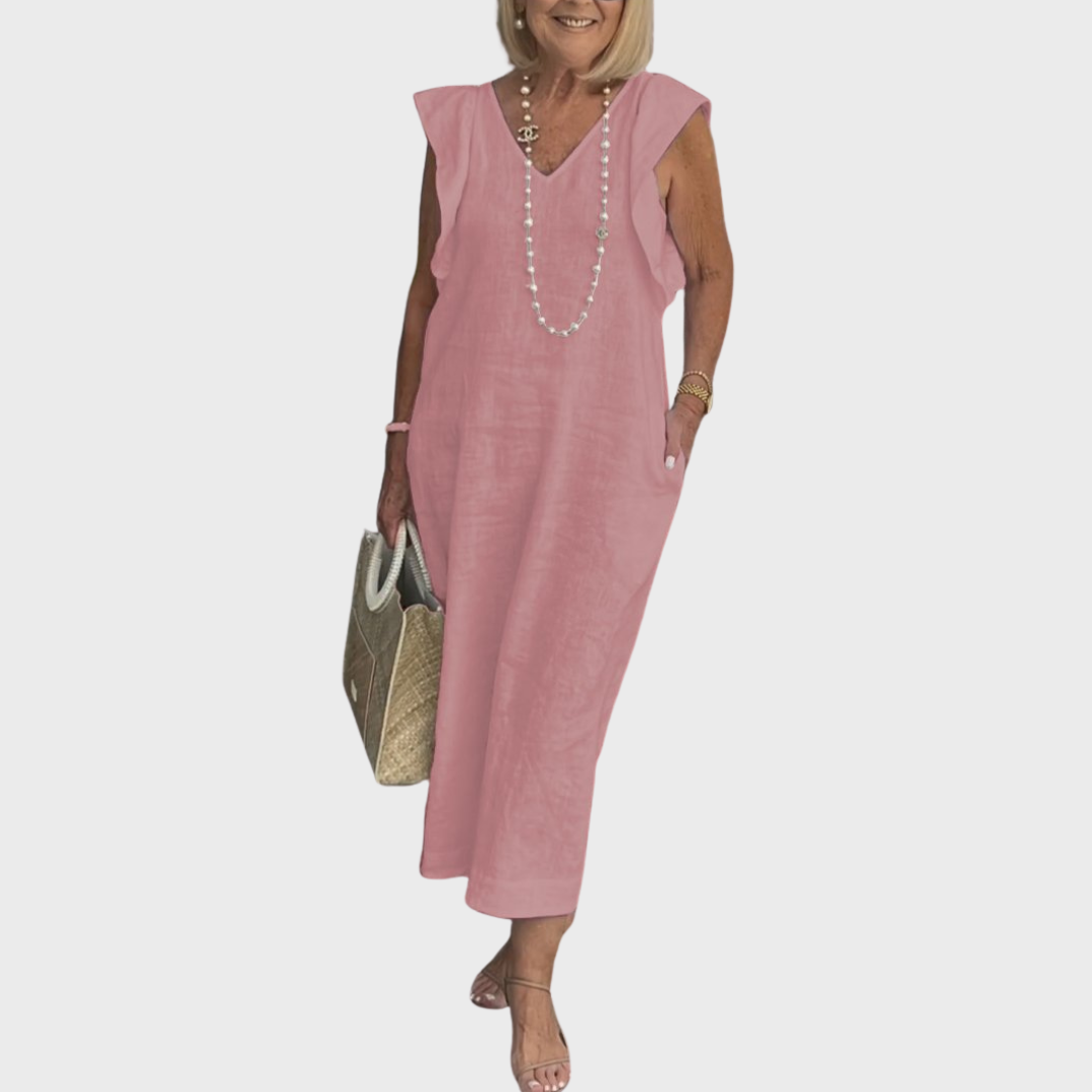 Versatile women's maxi dress: sleeveless, V-neck, ruffle shoulders, pockets. Great for day, evening, or travel.