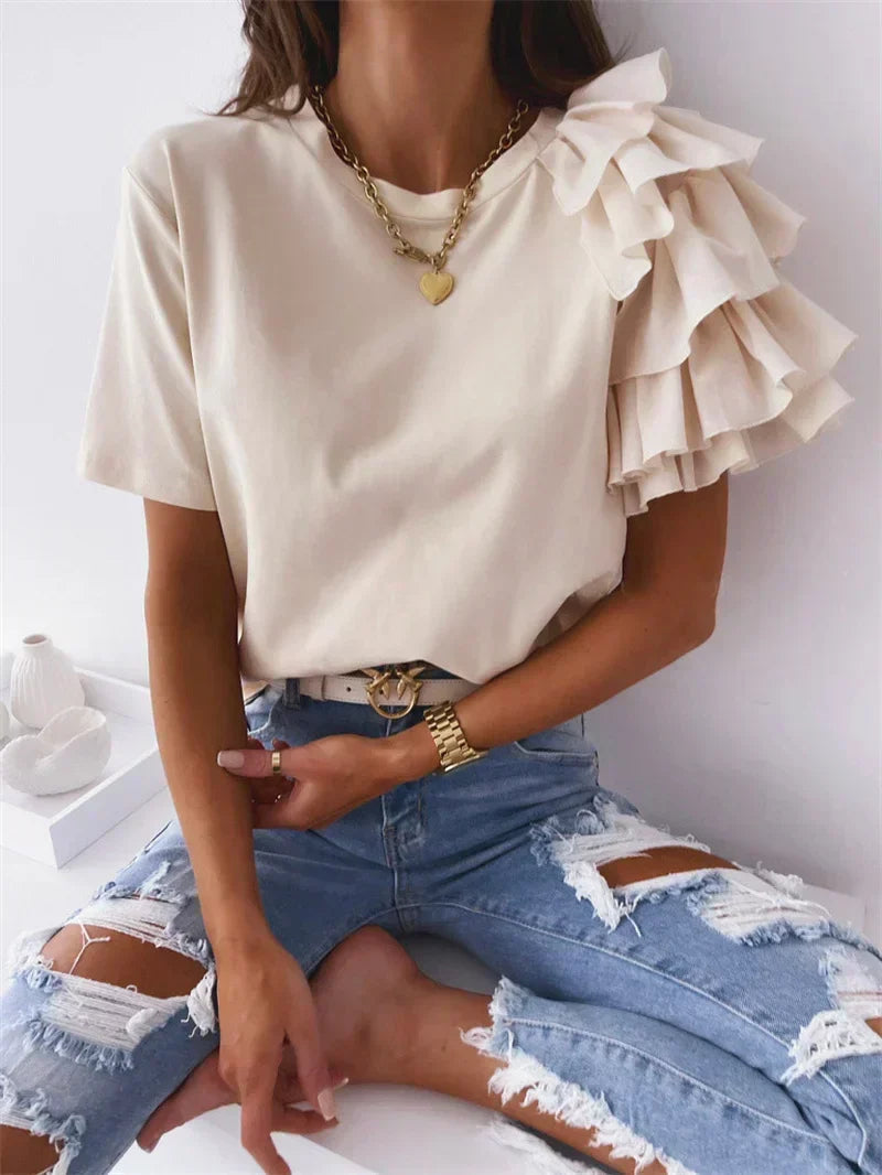 Effortlessly stylish women's ruffle sleeve top. Comfortable, elegant blouse with a unique design for summer fashion.