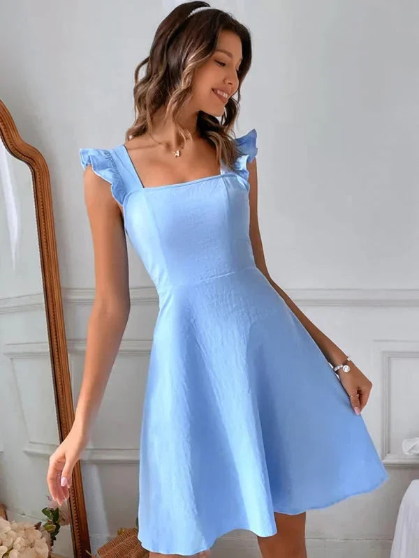 Summer party women's dress: mini length, ruffle straps, A-line shape, and a captivating bow back.