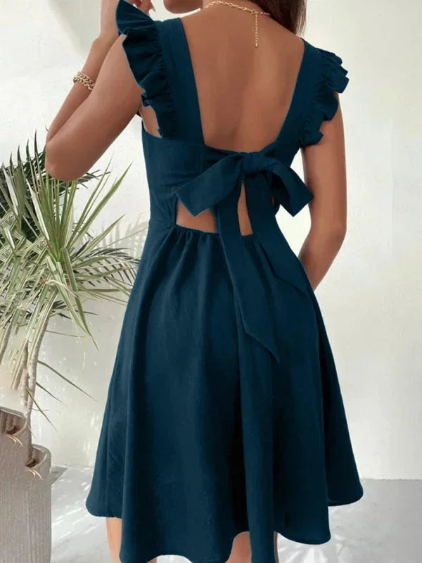 Stylish women's mini dress: ruffle straps, A-line fit, square neck, and a pretty bow back feature.