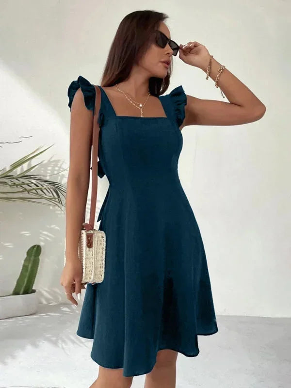 Women's party dress, mini length, ruffle straps, A-line silhouette, and a beautiful back bow.
