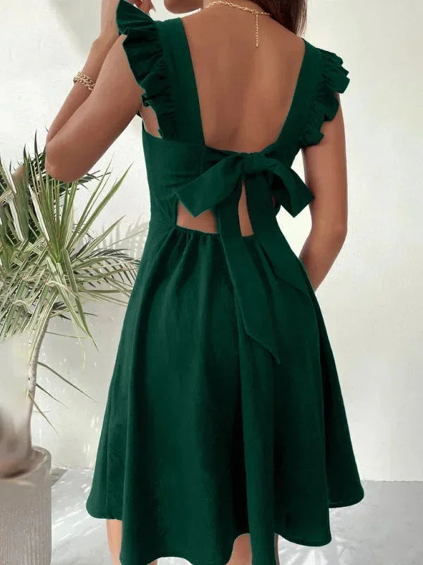 Elegant square neck mini dress for women, accented with playful ruffle straps and a bow back.