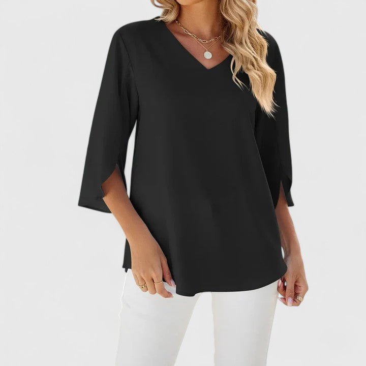 Women's fashionable spring blouse: a pretty ruffle V-neck and unique split sleeves offering a chic, feminine look.