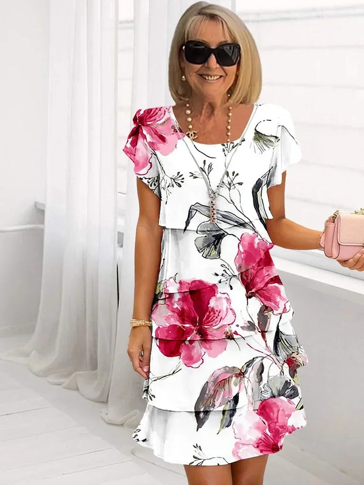 Women's ruffled floral midi dress with delicate pleats. Perfect for summer, spring, and elegant occasions.