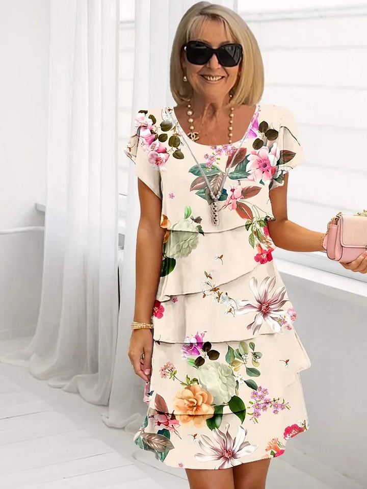 Beautiful women's floral midi dress, a ruffled sleeveless design with elegant pleats. Perfect for spring & summer.