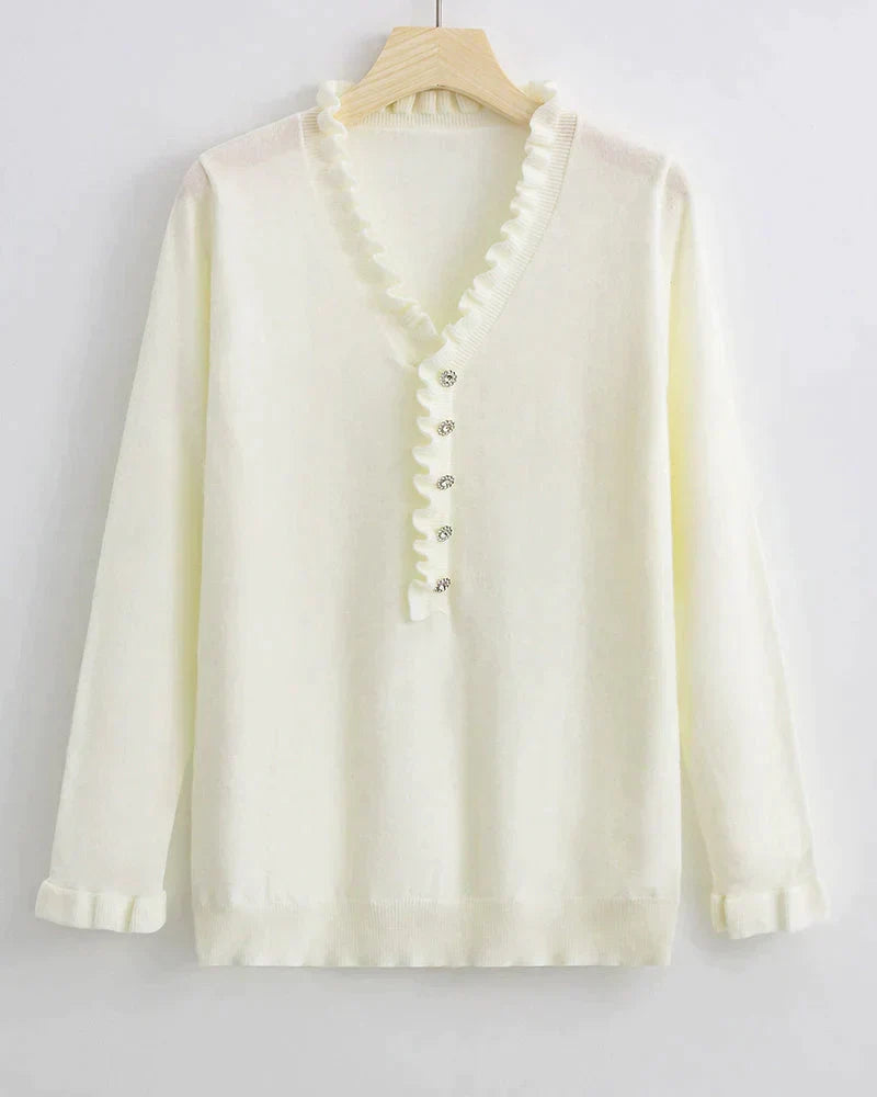 Light blue women's ruffled knit sweater with stylish button details. This cozy top is ideal for casual fashion.