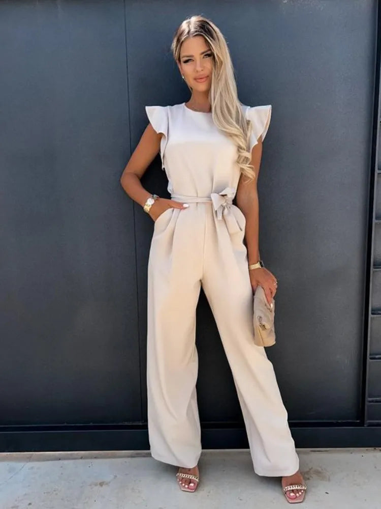 Women's ruffled wide-leg jumpsuit with a stylish tie waist, perfect for effortless chic summer fashion.