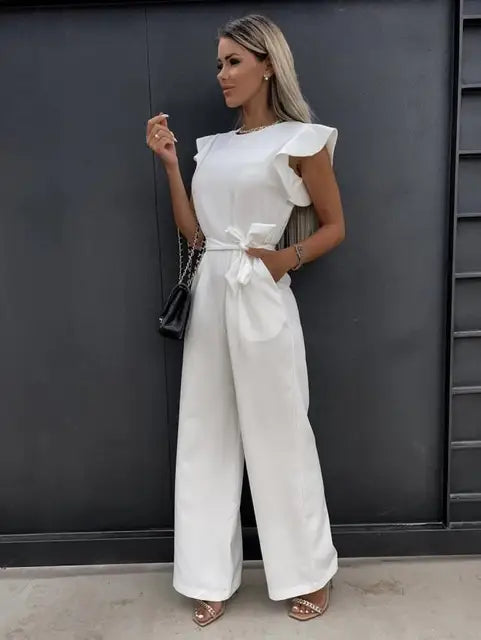 Elegant women's ruffled wide-leg jumpsuit with tie waist, ideal for chic summer daywear or eveningwear.