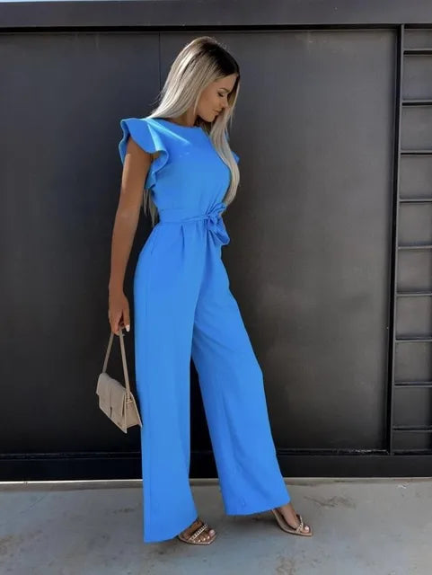 Close-up of a women's ruffled wide-leg jumpsuit with a detailed tie waist for an elegant look.