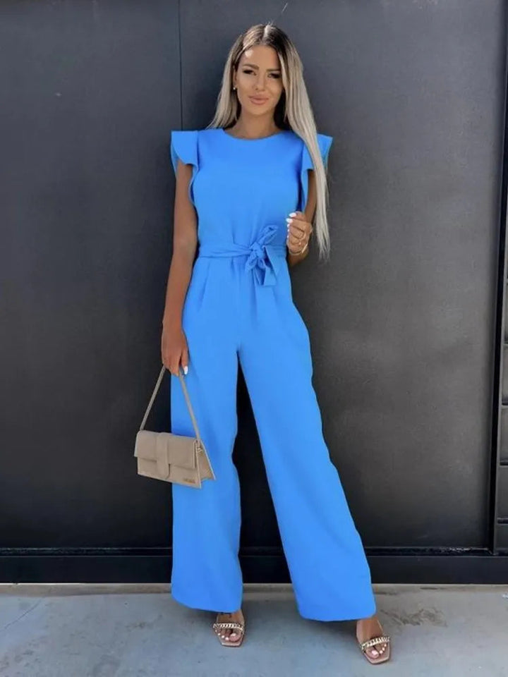 Stylish women's jumpsuit with delicate ruffles, a comfortable wide-leg design, and a flattering tie waist.
