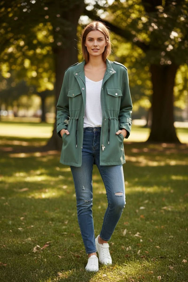 Fashionable women's utility jacket with a distinctive open back, creating a rugged chic modern look.