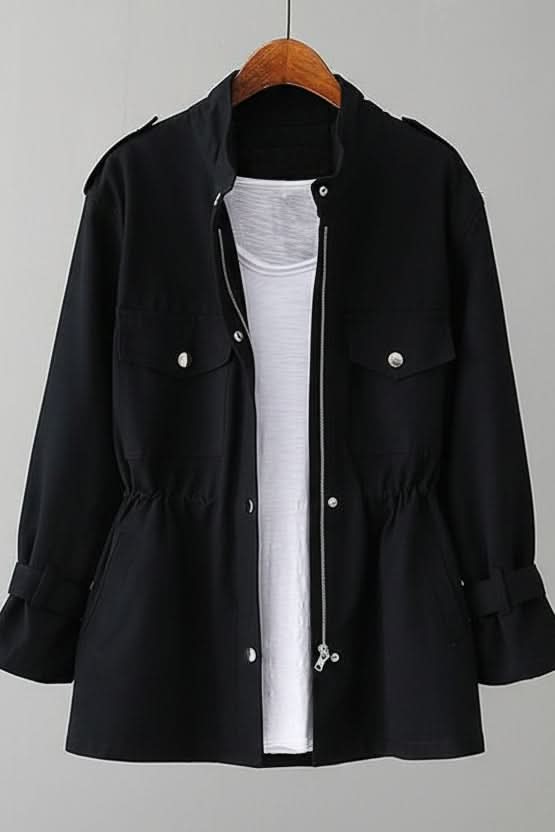 Statement women's utility jacket with a bold open back design, offering rugged modern style.