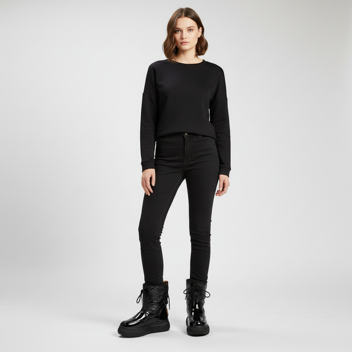 Stylish women's black winter boots, waterproof and insulated, with fur lining for cold weather