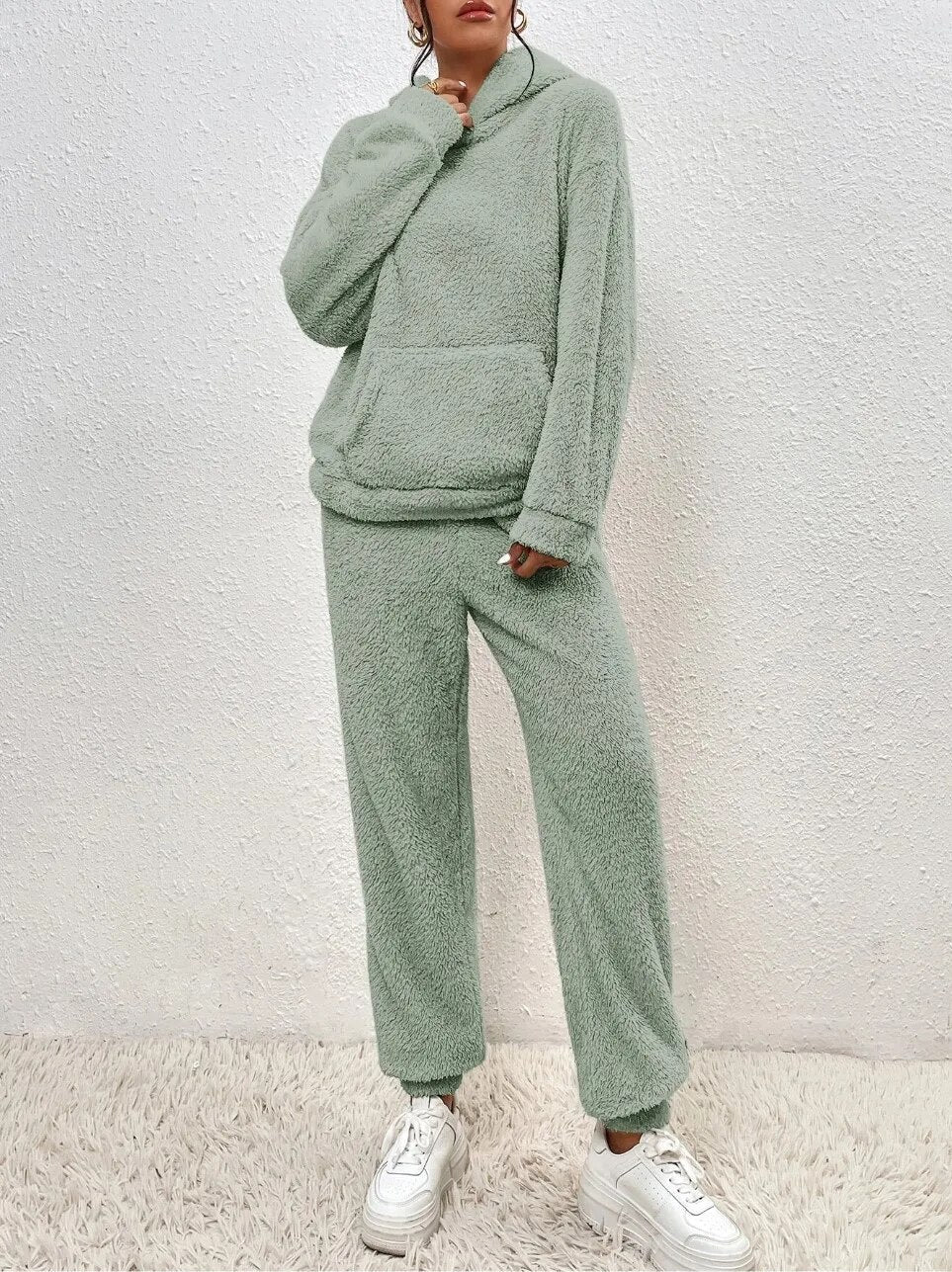 Comfortable women's two-piece set, a long hoodie with practical pocket and matching soft fabric trousers