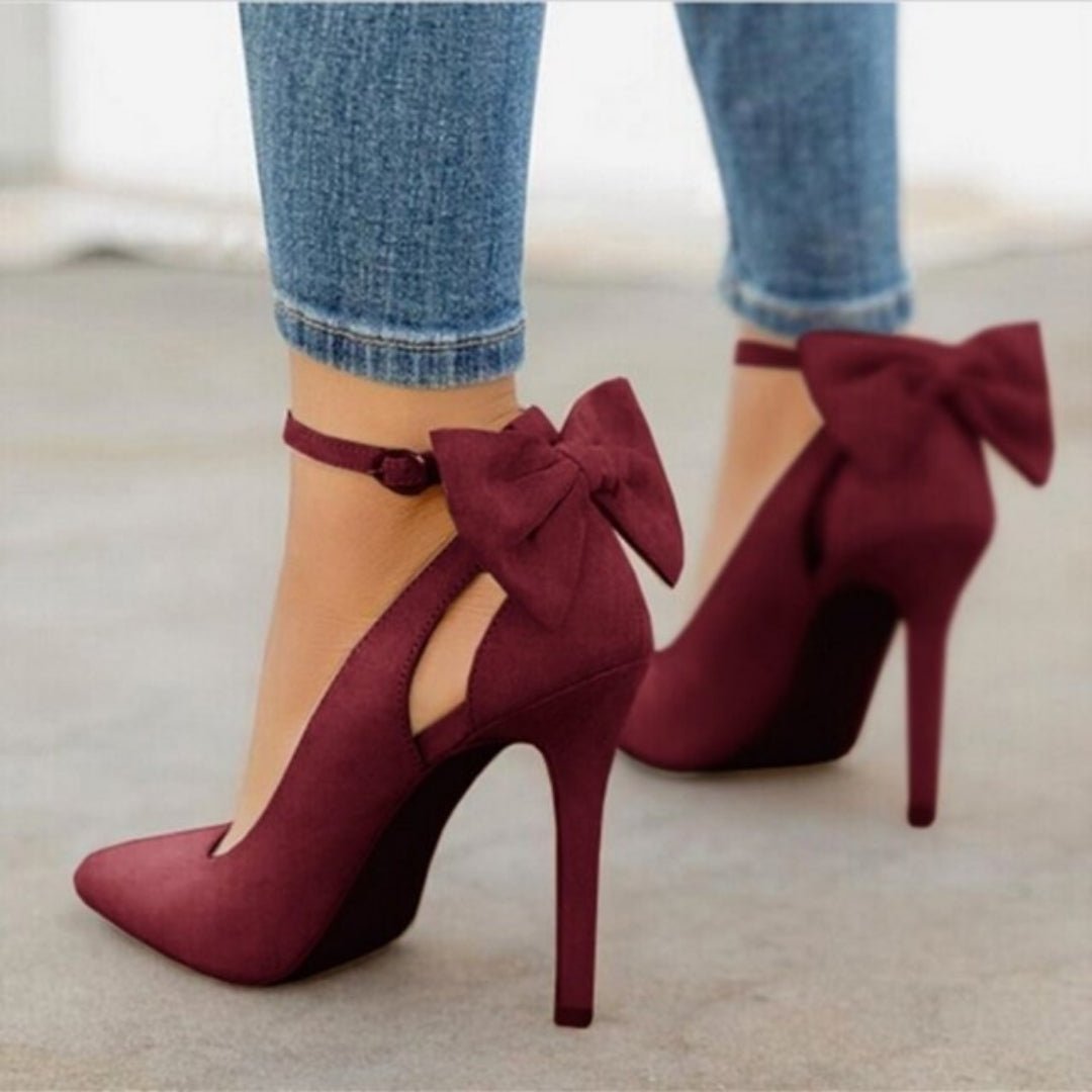 Women's satin pointed toe high heel court shoes with an elegant bow detail, perfect for parties.