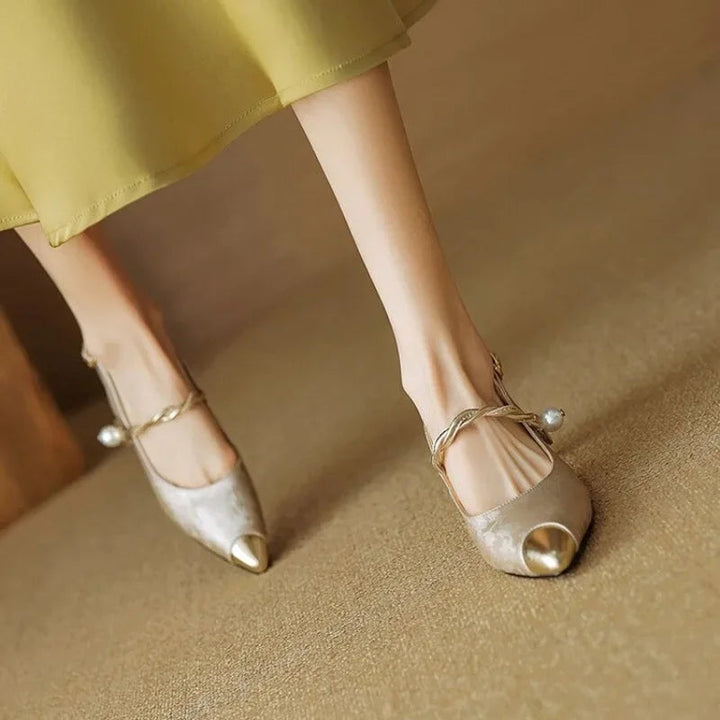 Versatile women's Savana sculpted kitten heels. Elegant pointed toe and subtle pearl accents for any dressy occasion.