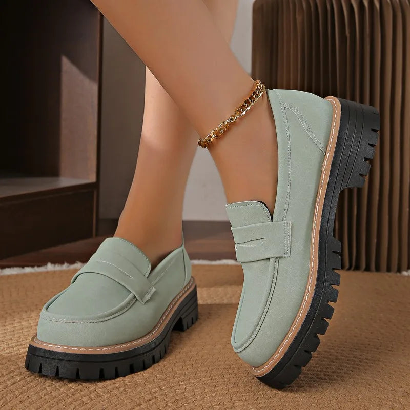 Savira women's platform loafers in close-up, showcasing their soft cushioning and sleek design.