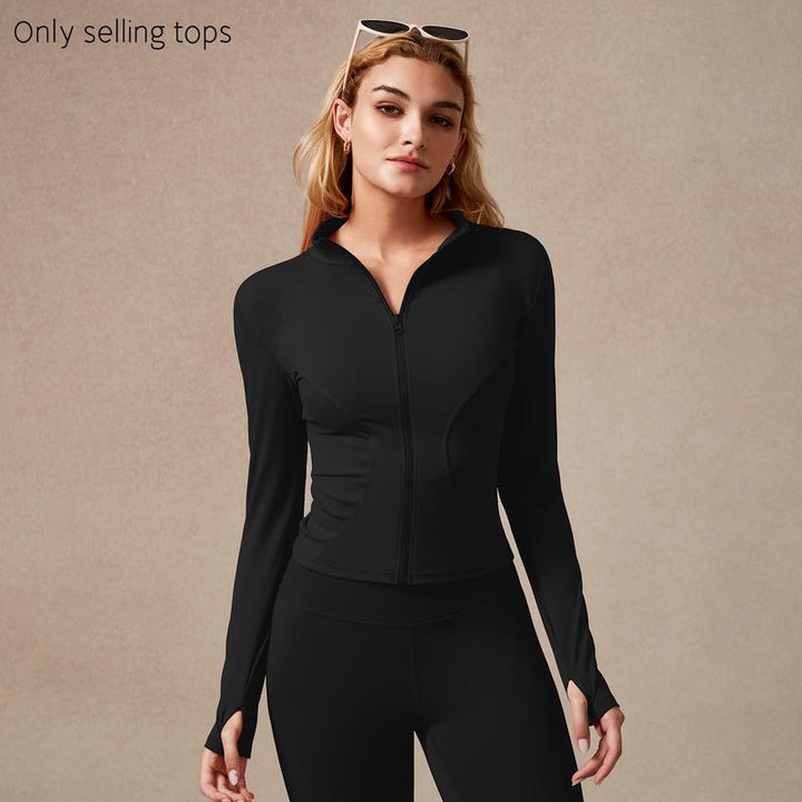 Women's sculpted zip performance top for gym. Sleek long sleeve activewear for sport & fitness.