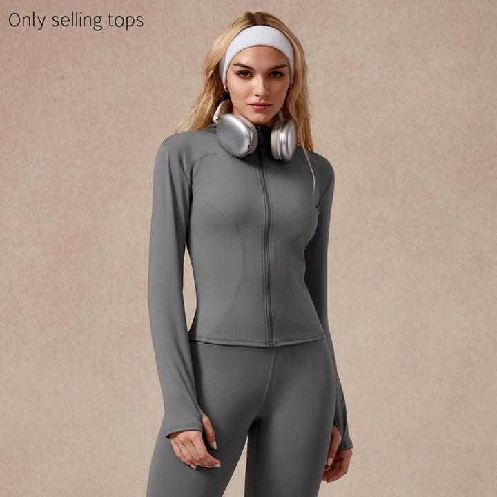 Sculpted women's athletic zip top. High-performance long sleeve for gym workouts & sportswear.