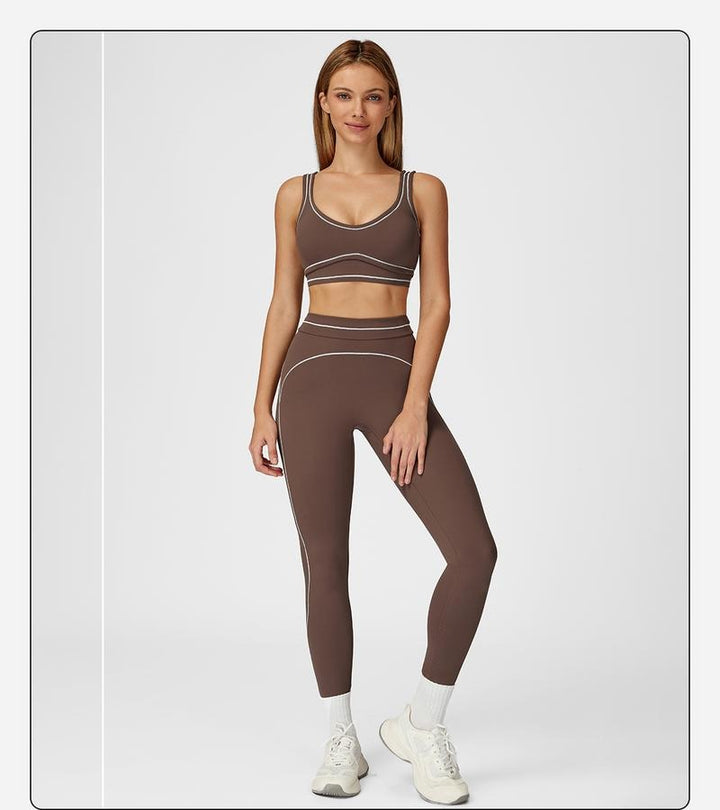 Athletic women's gym set: sculpting high-rise leggings & sports bra, perfect for yoga & training.