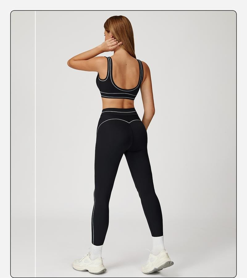 Women's athletic sculpting workout set with high-rise leggings and a comfortable sports bra for fitness.