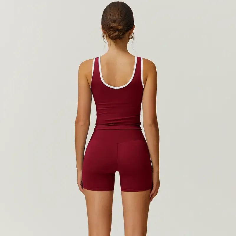 Nylon blend women's activewear set: sculpting high-waist shorts & sports bra designed for performance.
