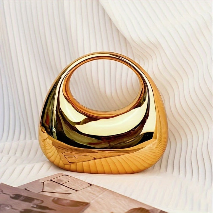 Women's sculptural acrylic clutch bag, perfect for evening parties.