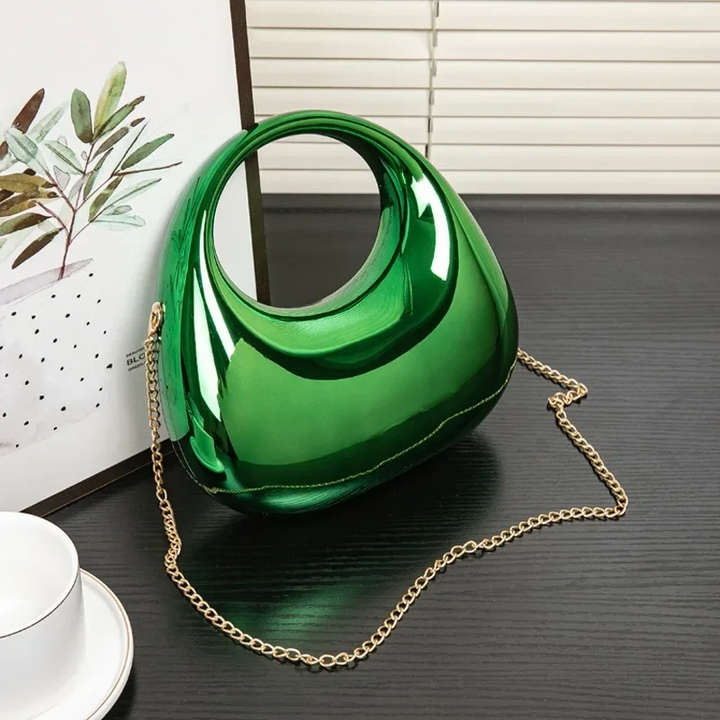 Ladies' sculptural acrylic evening clutch, sleek and modern accessory.
