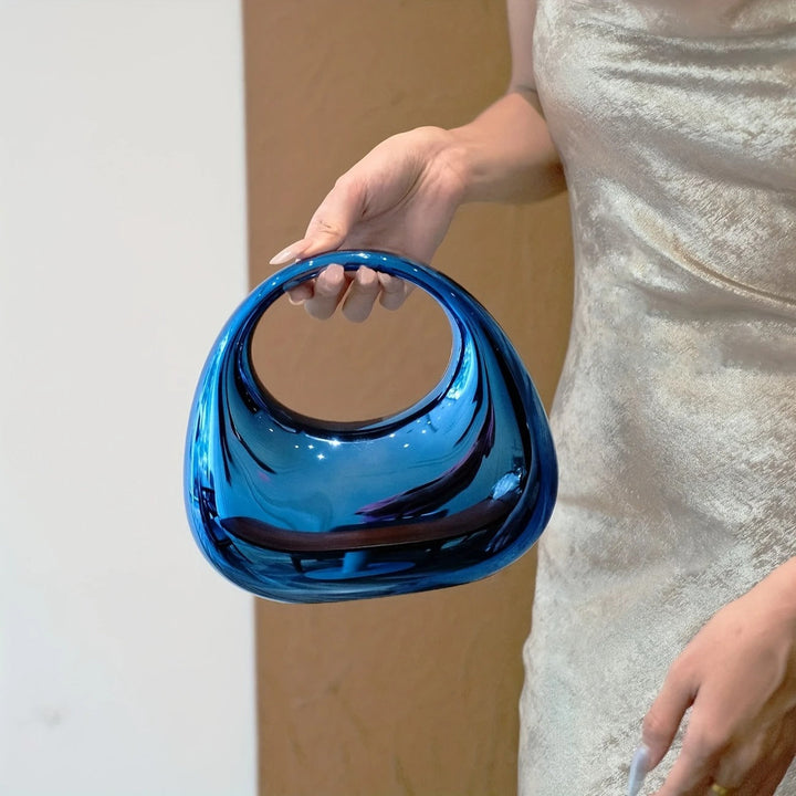 Women's fashion sculptural acrylic handbag, a glamorous party piece.